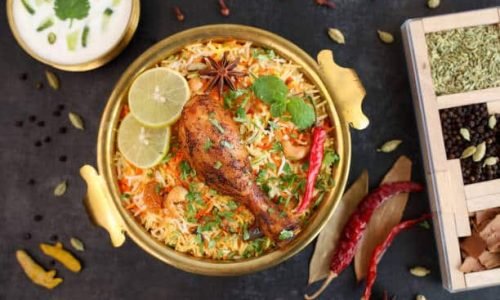 Chicken biryani Spicy Indian Malabar biryani Hyderabadi biryani, Dum Biriyani pulao golden bowl Kerala India Sri Lanka Pakistan basmati rice mixed rice dish with meat curry Ramadan Kareem, Eid
